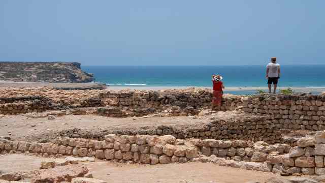 Oman-Dhofar-near-Salalah-Khor-Rori-Tourists-at-ruins-of-the-ancient-settlement-of-Sumhuram-Frankincense-Trail-UNESCO-Wild-camels-Salalah-Travelstoyou