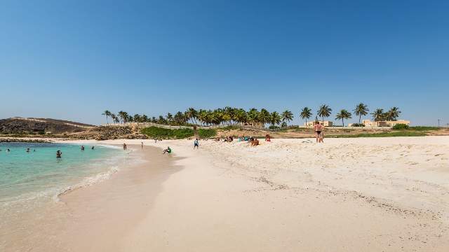 Enjoy Salalah's Stunning Natural Beauty and Wildlife 10 People-are-resting-and-relaxing-on-the-family-beach- in-Salalah-Oman-Travelstoyou