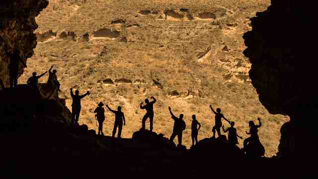 Travelers-and-tourists-entrance-of-a-cave-in-Salalah-Oman