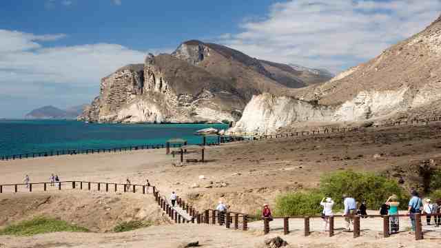 Enjoy Salalah's Stunning Natural Beauty and Wildlife 8 Travelstoyou-Salalah-Oman-Mughsail-beach-tourists-at-coastline-viewpoint