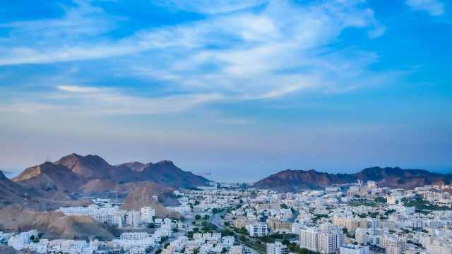 Next travel destination Oman affordable vacation Planning Service and Company 8 Wide-View-of-Muscat-Cityscape-with-blue-sky-and-mountains-from-the-top-of-a-hill-Oman